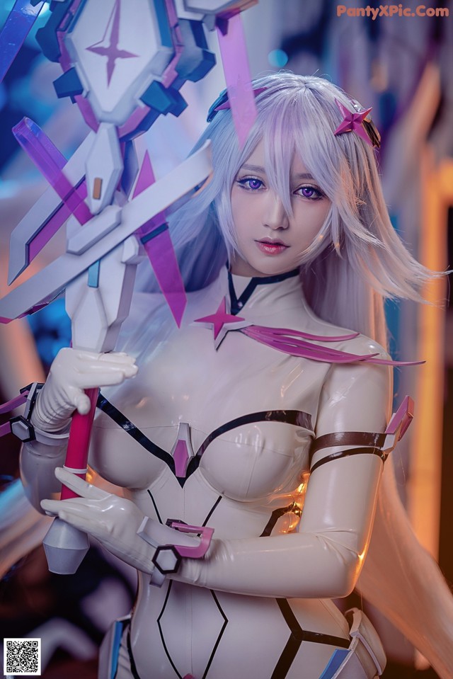 A woman in a white and pink outfit holding a sword.