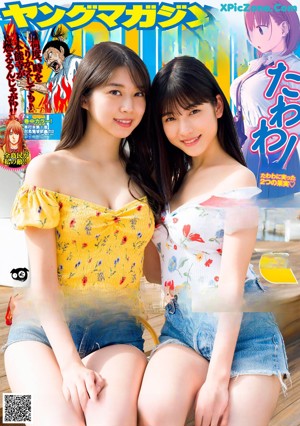 A couple of women in bikinis standing next to a swimming pool.