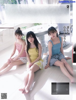 A group of women sitting on top of a magazine cover.