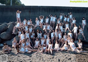 A group of women in bikinis posing for a magazine cover.